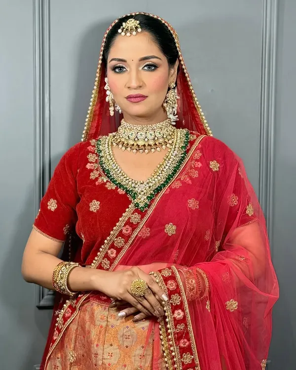 This is the classic Indian bridal look I love to create. My focus is always on creating a flawless, radiant base with soft glam eyes and a bold lip, ensuring you look like a polished, confident version of yourself on your big day.