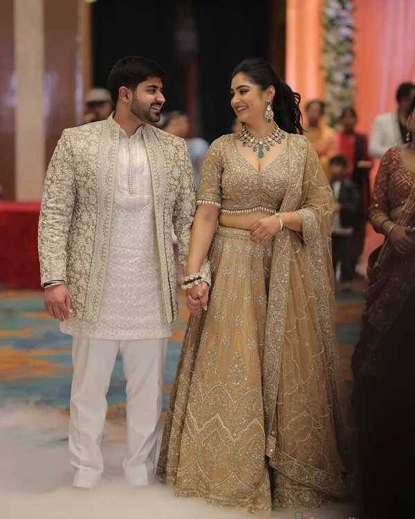 For our engagement, we chose sparkling, neutral outfits that felt both grand and personal. I believe a couple's style should be a conversation, and here, our coordinated embroidered ensembles speak of timeless elegance.