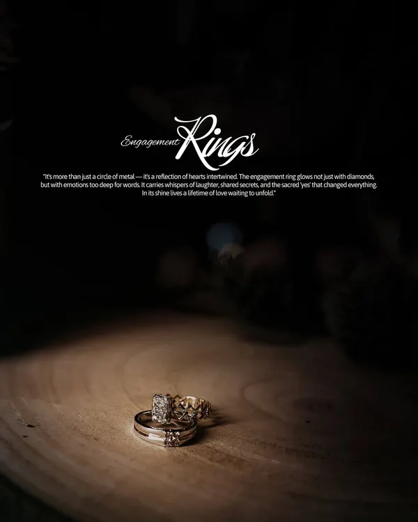 A dramatic, spotlight shot of the engagement rings resting on a piece of wood. This isn't just a photo of jewelry; it's a portrait of a promise.