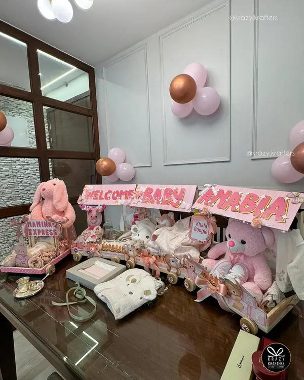 This beautiful baby girl trousseau train, created for a client's 'nanihal' welcome, is one of my favorite projects. I love designing these elaborate, themed displays to make welcoming a new baby an incredibly grand and memorable affair.