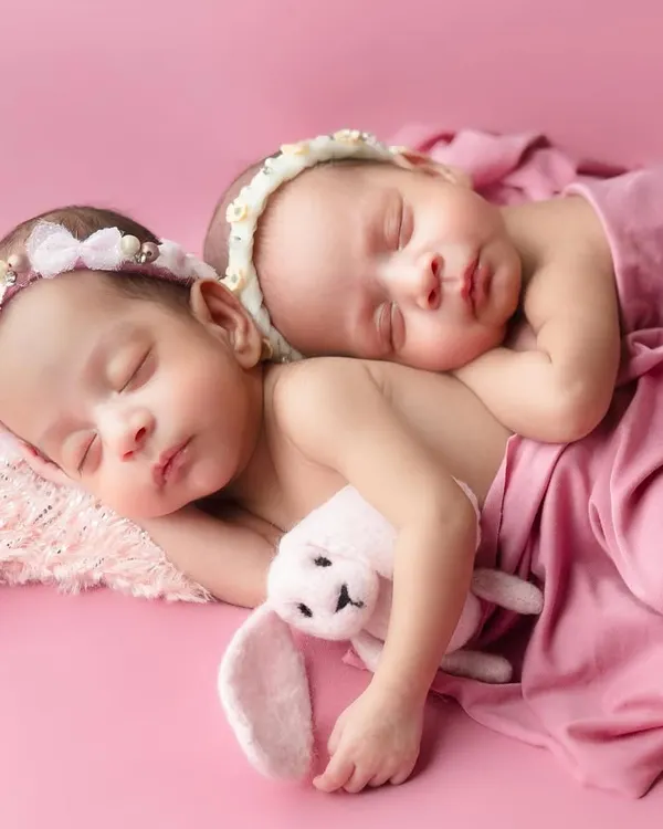 What can I say, the picture says it all. Sharing a womb and now forever sharing every experience in this world. Capturing the bond between newborn twins is truly magical.