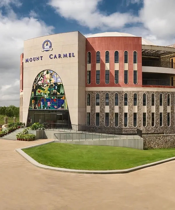 The primary wing of Mount Carmel School in Gurgaon, a project that embodies our vision for educational architecture. The circular building, set on a five-acre campus, is designed to nurture curiosity and create a seamless flow between learning and creativity, featuring a facade of exposed concrete, local stone, and red sandstone.