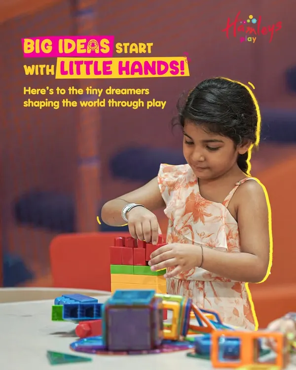 Big ideas start with little hands! Here, a young creator is focused on building with magnetic tiles. Our creative stations are where imagination takes shape, fostering innovation and problem-solving skills.