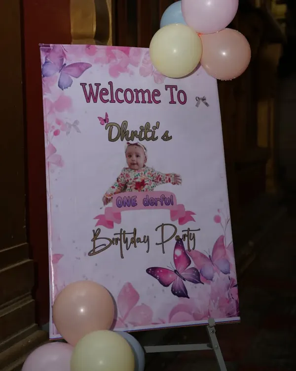A personalized welcome board for a butterfly-themed first birthday party. This is a beautiful way to greet your guests and introduce the theme.