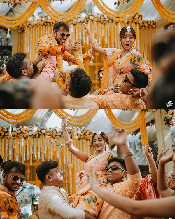 The sheer fun of a Haldi ceremony, with the bride and groom lifted on the shoulders of their loved ones. These are the high-energy, candid moments that make a wedding album unforgettable.