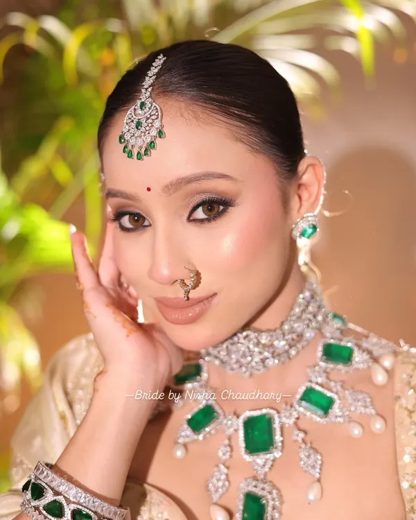 A soft glam bridal look perfect for a morning wedding. I focused on creating luminous skin, defined eyes with a subtle shimmer, and a neutral lip to complement the magnificent emerald and diamond jewelry.
