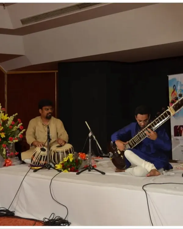 Performing a traditional Hindustani classical recital with a tabla accompanist at the India Habitat Centre, New Delhi. This is the classic setup for a pure musical experience.