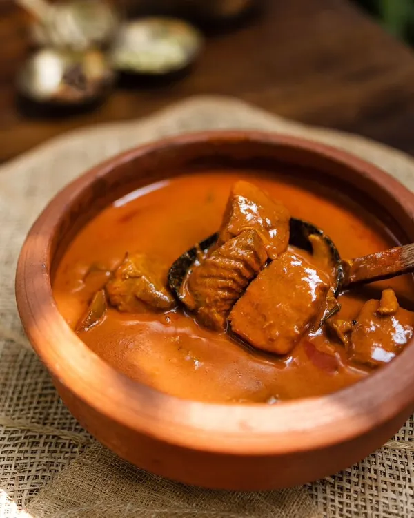 This is what real Kerala cooking is all about. My Alleppey Fish Curry is made the traditional way in a 'chatti' or earthen pot, which gives it a unique, deep flavour. It's packed with fresh Seer fish chunks in a thick, tangy, and spicy coconut gravy that is perfect for mopping up with appams or rice.