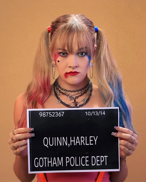 "Gotham P.D. has me." A fun and iconic mugshot from our Harley Quinn themed shoot. This shot is all about capturing the character's defiant and playful personality.
