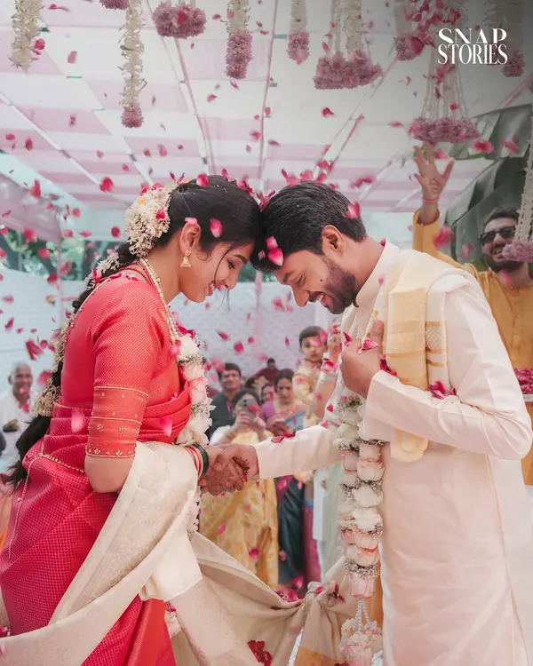 A perfect moment of joy captured as flower petals rain down on the happy couple. We specialize in capturing these dynamic, unscripted celebrations that define your wedding day.