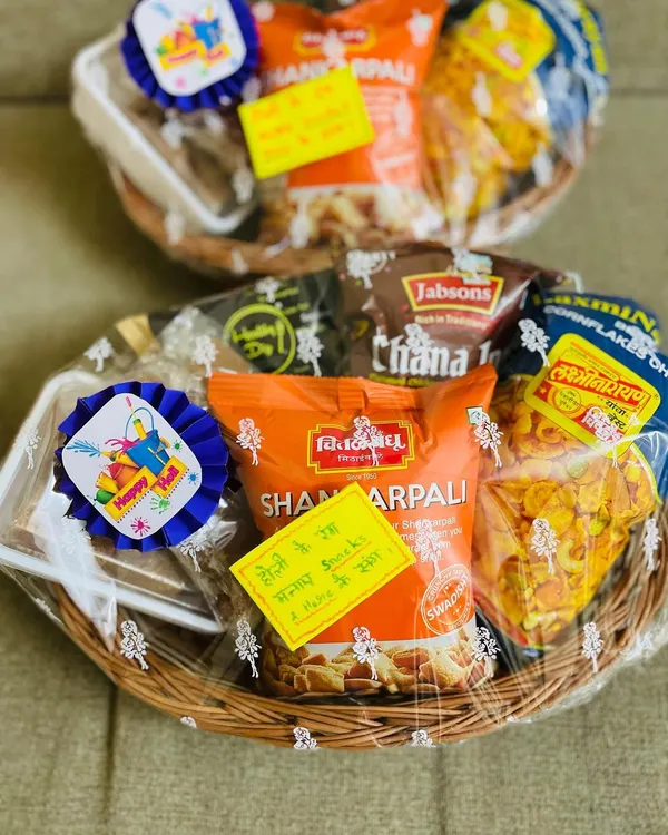 My Holi hampers are a customer favourite. Each basket is thoughtfully assembled with a variety of festive snacks and sweets, complete with a "Happy Holi" tag to make your gift extra special.