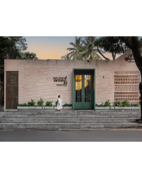 The street-facing view of Ishtaa at dusk, where the warm interior light glows through the entrance. This was our first F&B project, and we poured our hearts into creating a landmark in Jayanagar that felt both new and timeless.