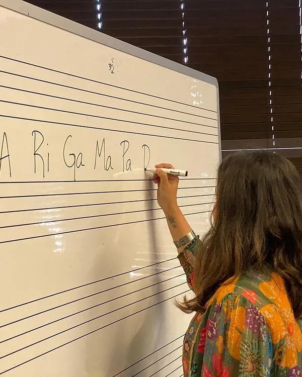 This is where the magic begins. I love breaking down the fundamentals of Carnatic music, like the basic swaras, on a whiteboard. It makes the concepts clear and accessible for everyone, no matter where you are on your musical journey.