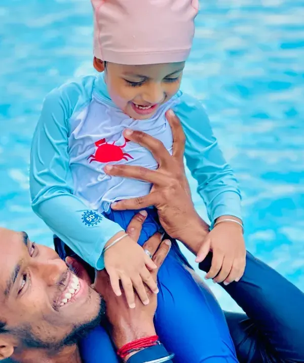 A moment of pure fun and connection between a coach and a young student. Our lessons for toddlers are designed to be engaging and build trust from the very first splash.