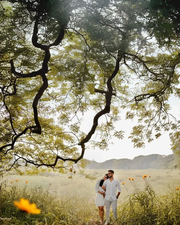 A quiet moment shared between two people, framed by the grand embrace of nature. I look for these instances of connection, creating images that feel both epic in scale and deeply personal in emotion. This is a perfect example of a golden hour pre-wedding portrait.