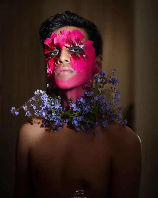 This is from an editorial concept where we explored the fusion of nature and identity. Working with a talented makeup artist, we used fresh flowers and bold color to create a piece of living art, pushing the boundaries of a typical portrait.