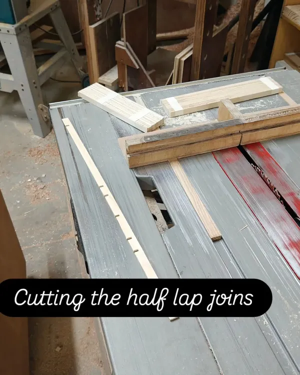 Using a table saw with a specialized jig to cut precise half-lap joints. This joinery technique is fundamental to creating strong, interlocking frames for projects like Kumiko panels.
