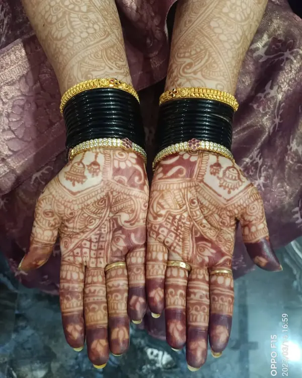 This is the beautiful, dark stain from my homemade organic henna paste, pictured a couple of days after application. The design features traditional motifs perfect for a wedding guest.