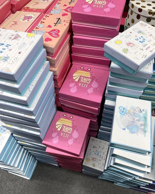 Stacks of my 'It's a Girl' and 'It's a Boy' announcement boxes, ready for a bulk order. These are perfect for sharing your joy with everyone.