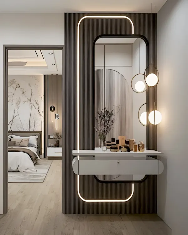 This elegant dressing unit features a modern, rounded mirror with integrated backlighting and stylish globe pendants. The dark, fluted wall paneling provides a dramatic backdrop for the sleek white floating vanity drawer.