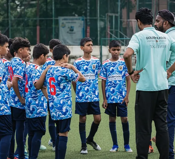 Our U13 team listening intently to their coaches during a Thane Youth League match. Tactical instruction is a key part of our training for senior squads.