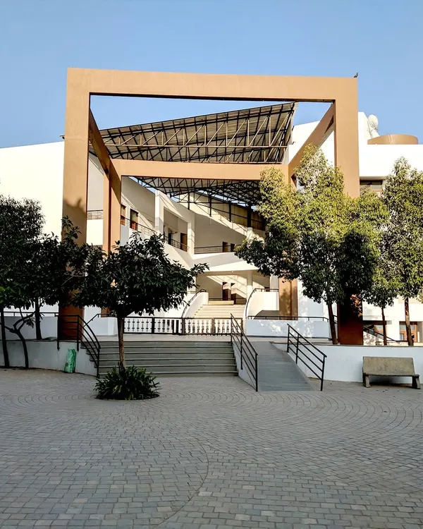 The main entrance plaza of Vidyamandir School in Palanpur was designed to be an open and accessible gathering space. The architectural framing and ramp access lead into a semi-covered area that uses natural ventilation, demonstrating our principles of climate-responsive educational building design from the very first point of entry.