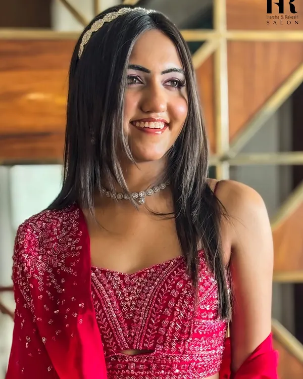 A stunning party-ready look. I created this glamorous style with soft, face-framing hair, a jeweled headband, and flawless makeup that highlights her features.