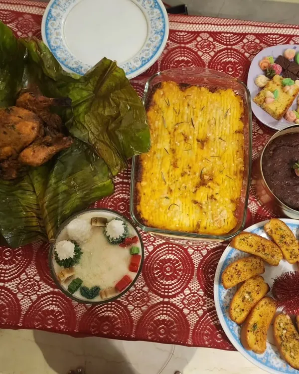 A beautiful Christmas catering spread featuring my Kerala spiced whole chicken, shepherd's pie, and rum cake. I love bringing festive cheer to your celebrations with a hearty, home-cooked meal.