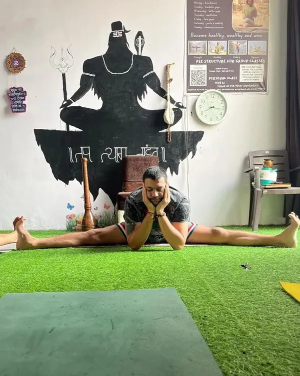 Working on the middle splits, or Samakonasana. This is a deep hip opener that takes time and patience. The goal is progress, not perfection.