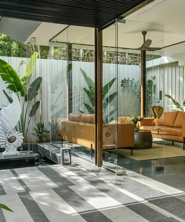 This is the entrance to my Soul Spring experience center, a space designed to dissolve the boundaries between inside and out. The design uses large glass openings and a tranquil water body to create a seamless transition, where the warmth of the reception area is met with the calm of the surrounding landscape. It is a physical representation of my belief that architecture should be in constant dialogue with nature.
