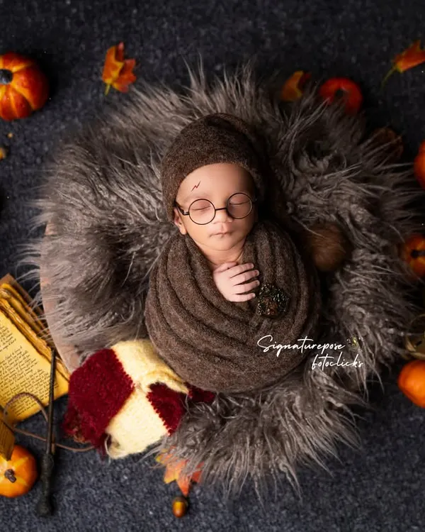 Our tiniest wizard has arrived! This Harry Potter themed newborn shoot is one of our most requested, complete with a Gryffindor scarf, wand, and spell books for a truly magical first portrait.