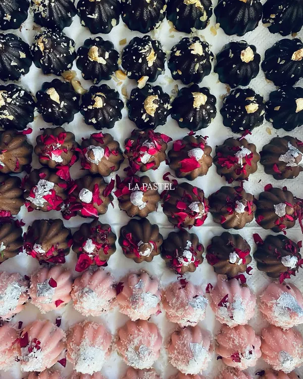My premium chocolate modaks are a best-seller during Ganesh Chaturthi. Here you can see the variety of flavors, from dark chocolate to rose-dusted milk chocolate.