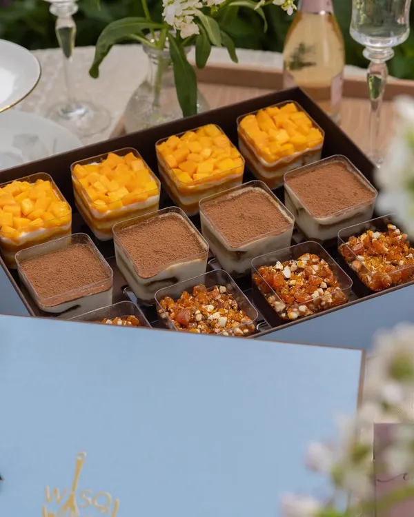This is happiness in a box. My assorted dessert cups feature a variety of my most loved treats, including Mango & Cream Cheese Trifle, Classic Tiramisu, and a decadent Chocolate & Caramel Trifle, making it the perfect gift or party starter.