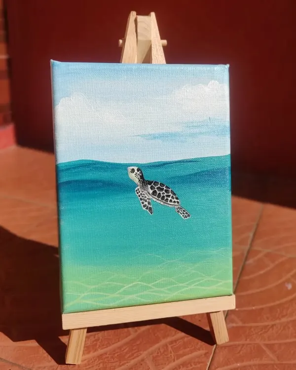 This mini acrylic painting of a sea turtle was a joy to create. The blending of the water colors and the details on the turtle shell make it a peaceful piece of ocean art.