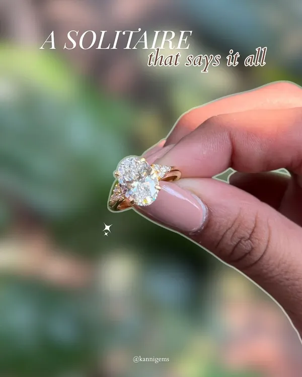 A solitaire that says it all. This oval-cut diamond ring, held in the light, shows how true style is not about trends, but about timelessness. It is a piece meant not just to be worn, but to be felt.