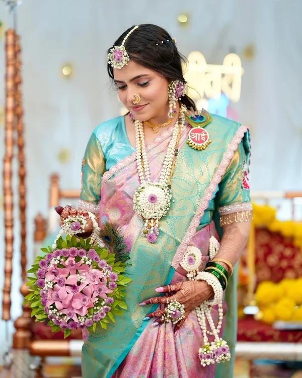 Glowing into motherhood. For her Godh Bharai (baby shower), I created a soft and radiant makeup look to enhance her natural warmth and joy, paired with a beautiful pastel nauvari saree and floral jewellery.