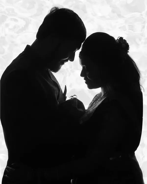 A silhouette captures the tender moment a new family is formed. We use creative lighting to create artistic and timeless newborn portraits that focus purely on the connection between parents and their baby.