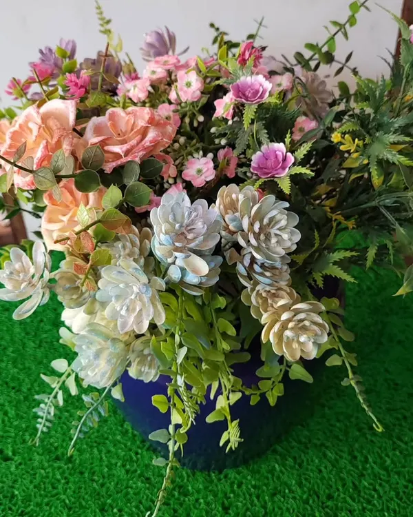This is a custom arrangement of high-quality artificial flowers and foliage in a classic blue ceramic pot. My artificial bushes are UV-treated and washable, ensuring they stay vibrant and beautiful with zero maintenance.
