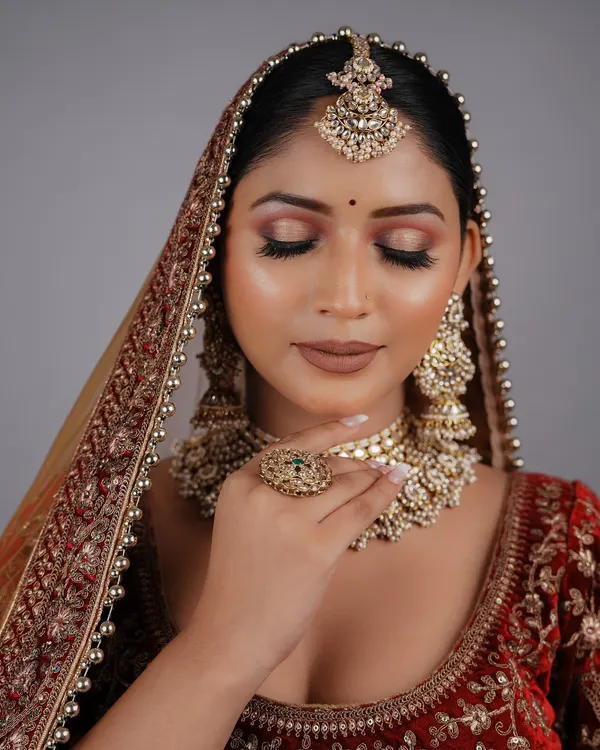 An outstanding bridal look created by a student for their final exam. The soft, blended eyeshadow and flawless skin are a testament to the skills they learned.