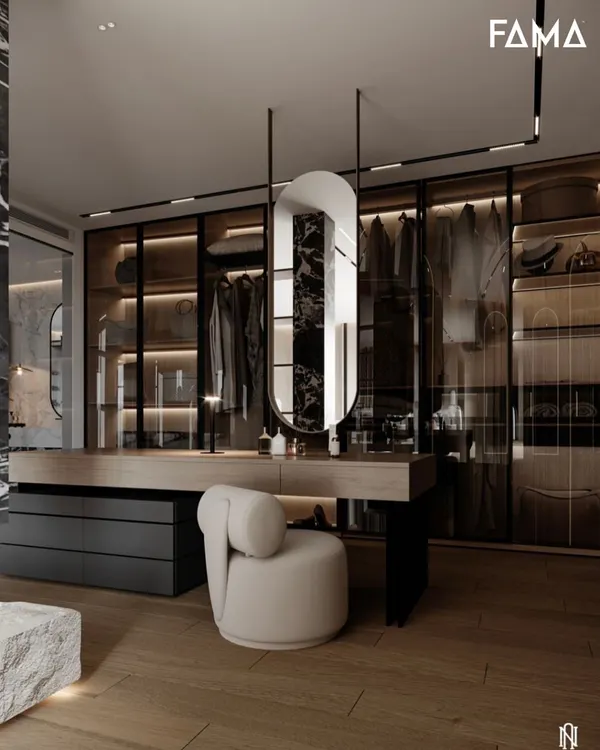 This is where your wardrobe and vanity become one cohesive space. This design features a sleek vanity table integrated with glass-fronted, internally lit wardrobes, creating a sophisticated and organized dressing room.