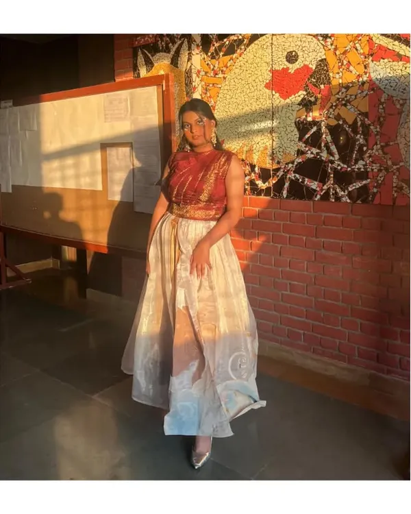 This was for a college fashion show. I styled this Indo-western look which features a draped brocade top and a layered organza skirt. It’s a great example of how to mix traditional fabrics with modern cuts.