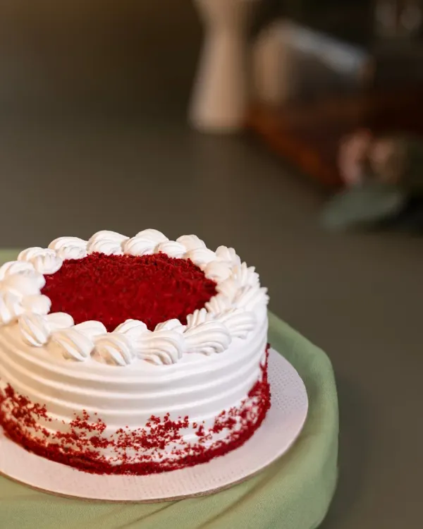 Our Red Velvet Bento Cake is a miniature version of the classic, with moist red velvet sponge and creamy frosting, perfect for a personal celebration.