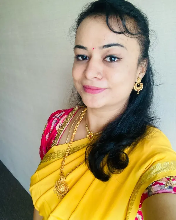A close-up of my self-makeover, featuring a simple and elegant look that complements this beautiful yellow Mysore silk saree. This is a great example of a classic, traditional look.