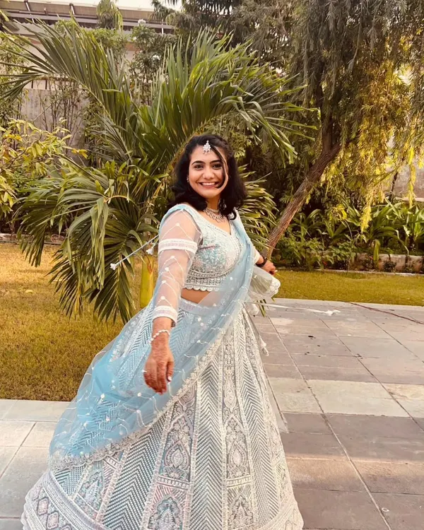 A happy client twirling in our popular powder blue lehenga. This rental is perfect for a daytime event or a sangeet night.