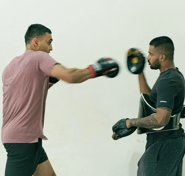 A glimpse into the sharp, focused pad work during a personal training session. Here, we're drilling a classic boxing combination, focusing on speed and accuracy.