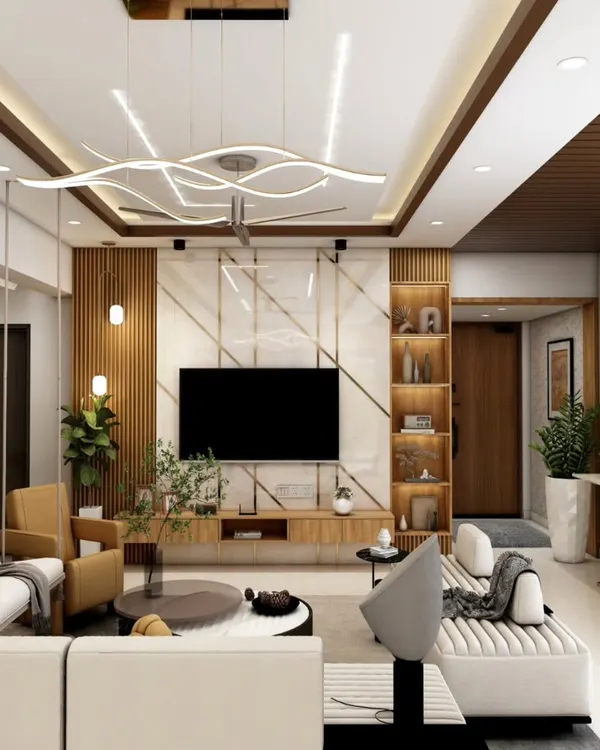 We design living spaces that are both luxurious and welcoming. This open-plan living area showcases our expertise in creating a cohesive look with custom TV units, sophisticated false ceiling lighting, and elegant furniture that defines the space while maintaining an airy feel.