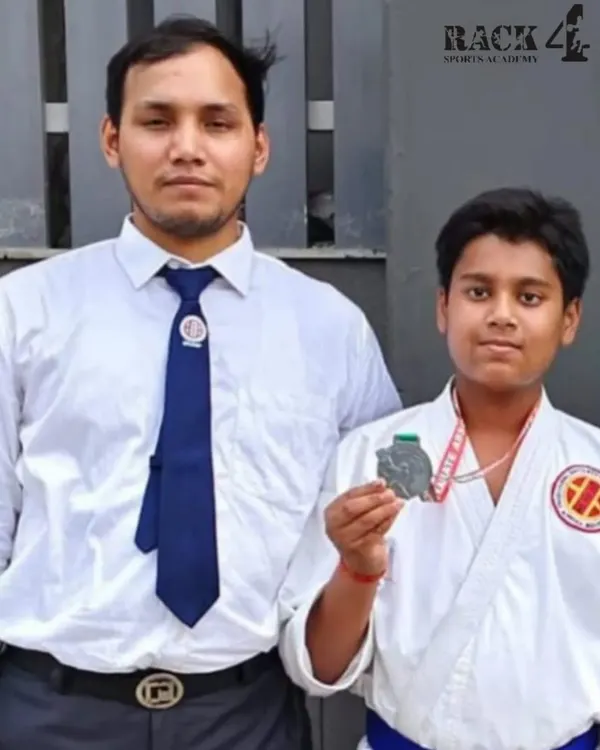 A proud moment for our student and his coach after winning a silver medal at the Open NCR Karate Championship 2024. This is a testament to their shared dedication.