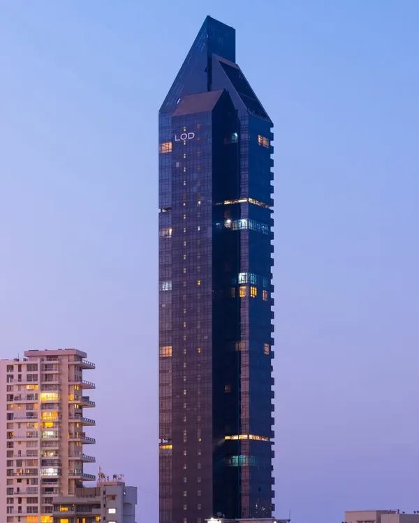 A view of the Lodha Altamount tower at dusk, where its distinctive silhouette stands out against the South Bombay skyline. The 40-story structure is a testament to our design philosophy of creating simple yet elegant architectural statements.