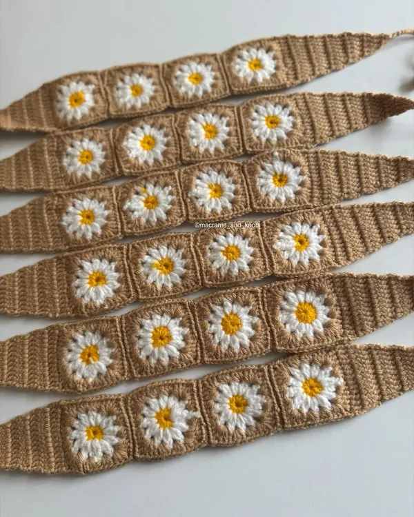 I am so excited to launch these beautiful crochet headbands. They feature a classic daisy granny square pattern on a tan background, perfect for a cottagecore or boho look.