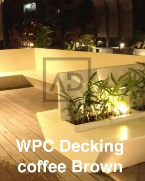 This L-shaped seating area is built directly into the terrace design, seamlessly integrated with the coffee brown WPC decking. The planters are also part of the structure, creating a clean, unified look.